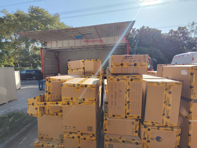 The cardboard box is waiting to be loaded onto the truck